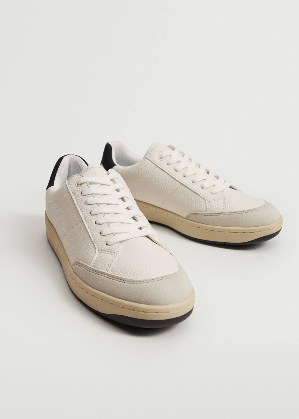 Mango Retro sneakers. a pair of white sneakers on top of a white surface. 