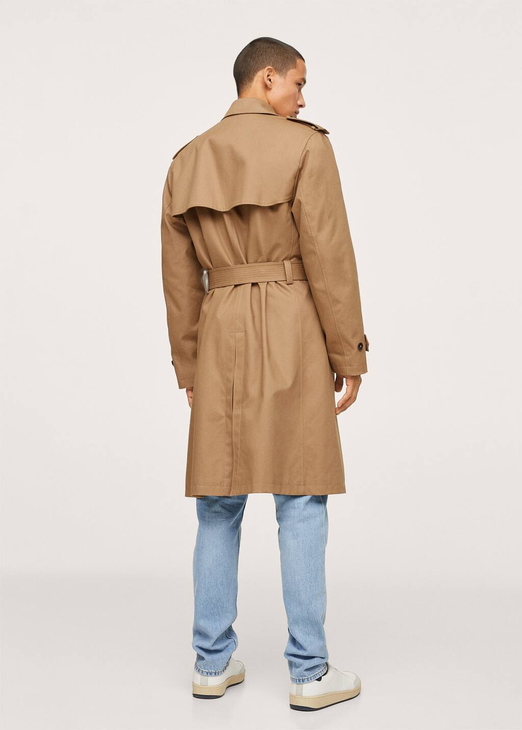 Mango Belt cotton-blend trench. a man wearing a tan trench coat and jeans. Mango Belt cotton-blend trench. a man wearing a tan trench coat and jeans.