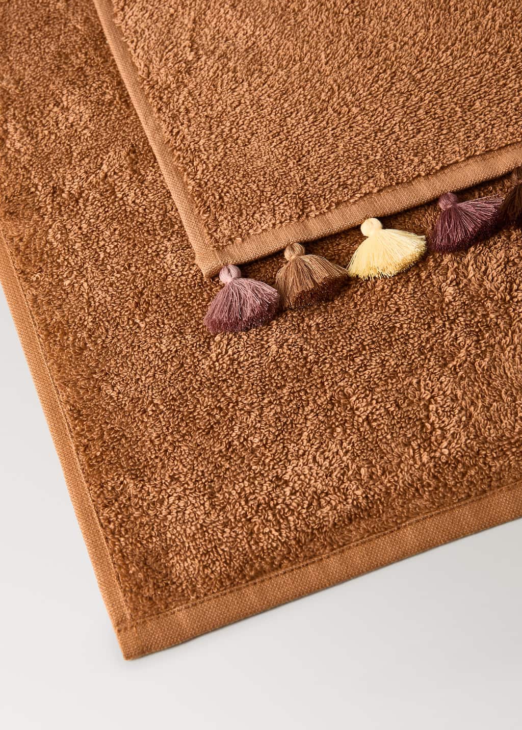 Children's cotton bath towel with multi-colored pom-poms