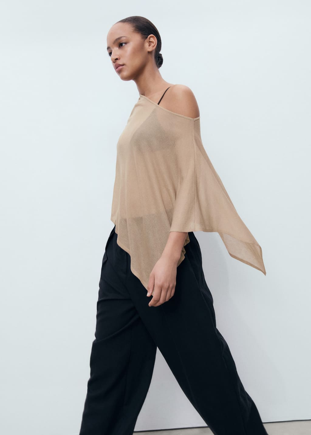 Asymmetrical knitted cape