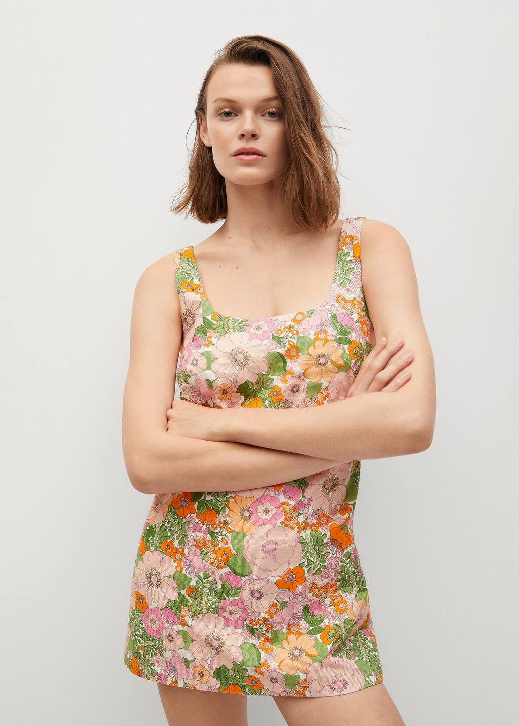 Mango Floral print jumpsuit. a woman in a floral dress posing for a picture. 