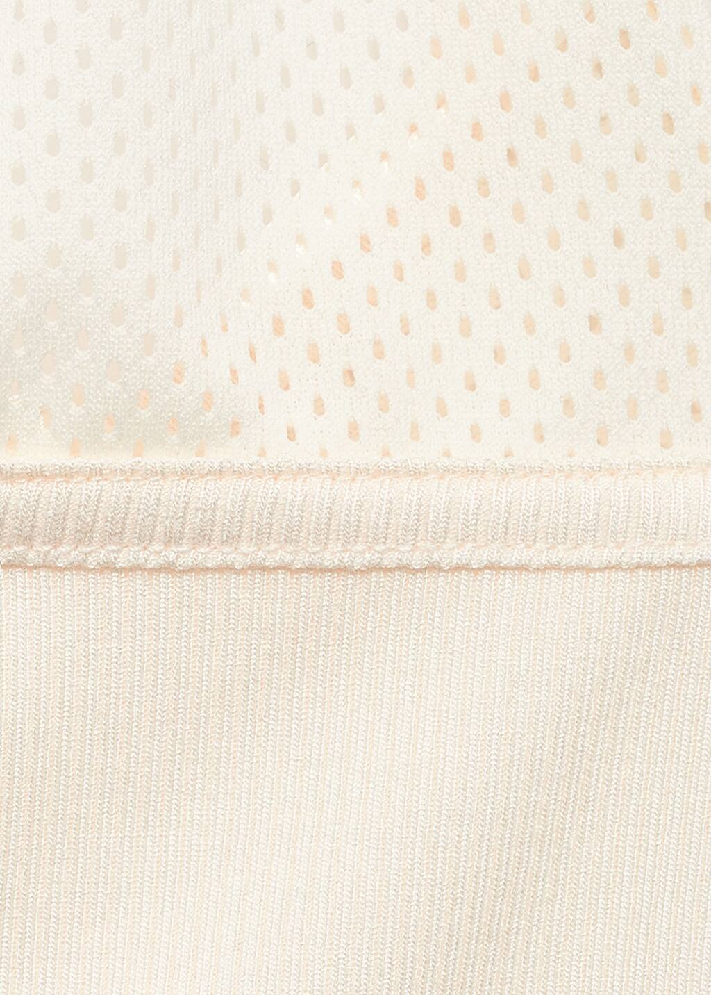 Top with perforated neckline
