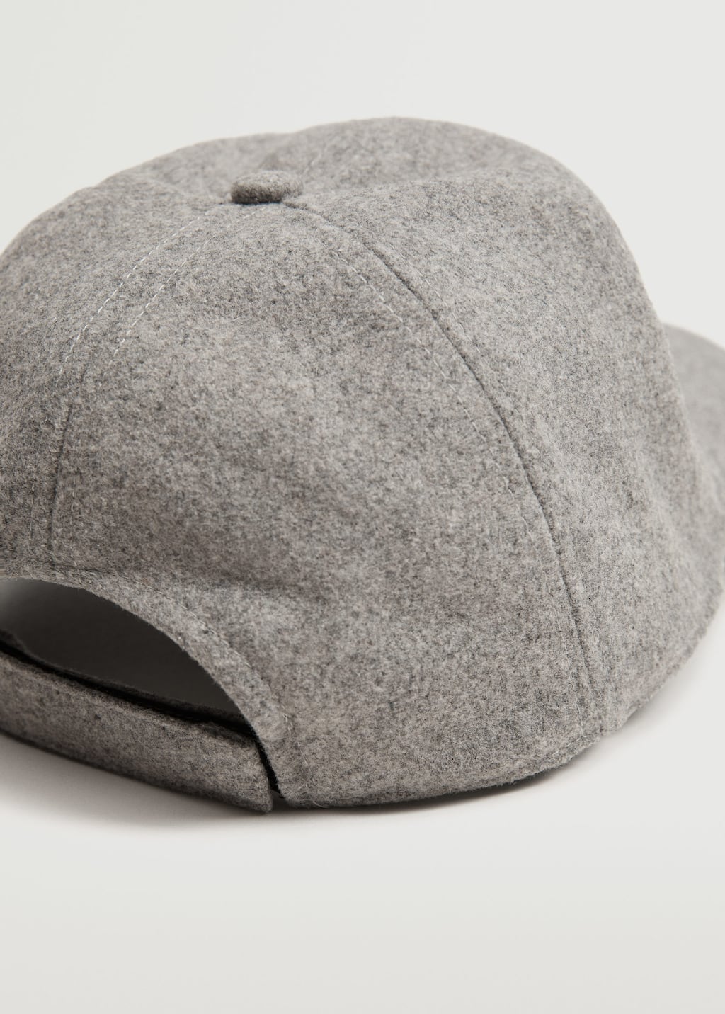 Mango Wool-blend baseball cap. a close-up of a hat on top of a white surface. 