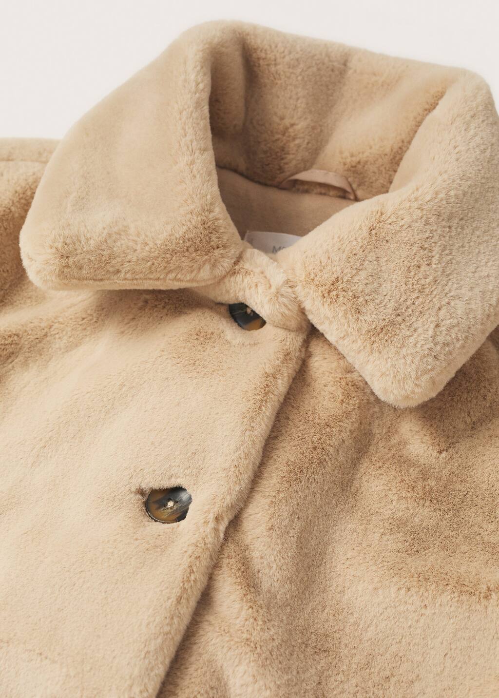 Mango Lapels faux fur coat. a close-up of the collar of a coat. 