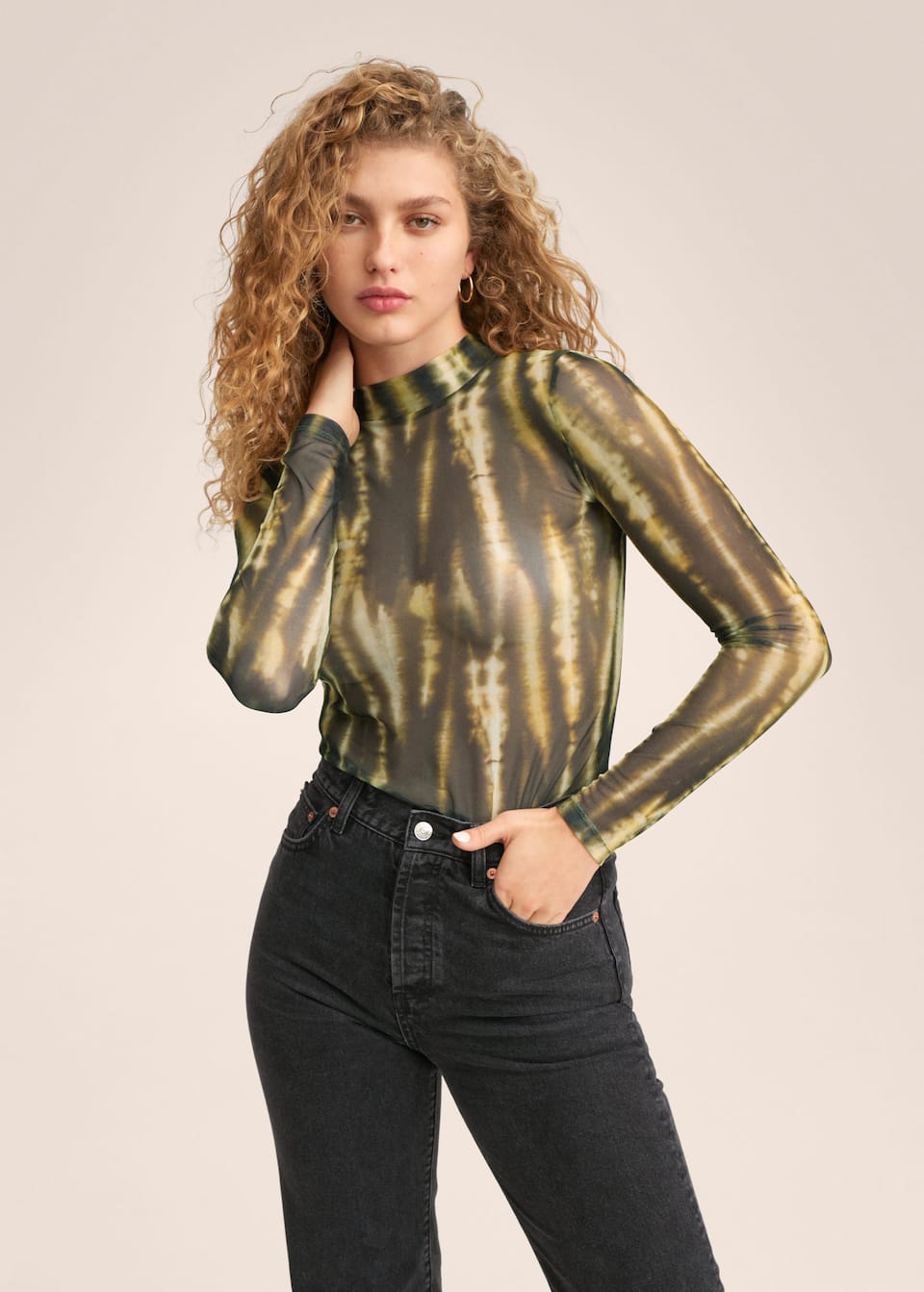 Sheer abstract print tie dye long sleeve turtle neck top in yellow and khaki tones.