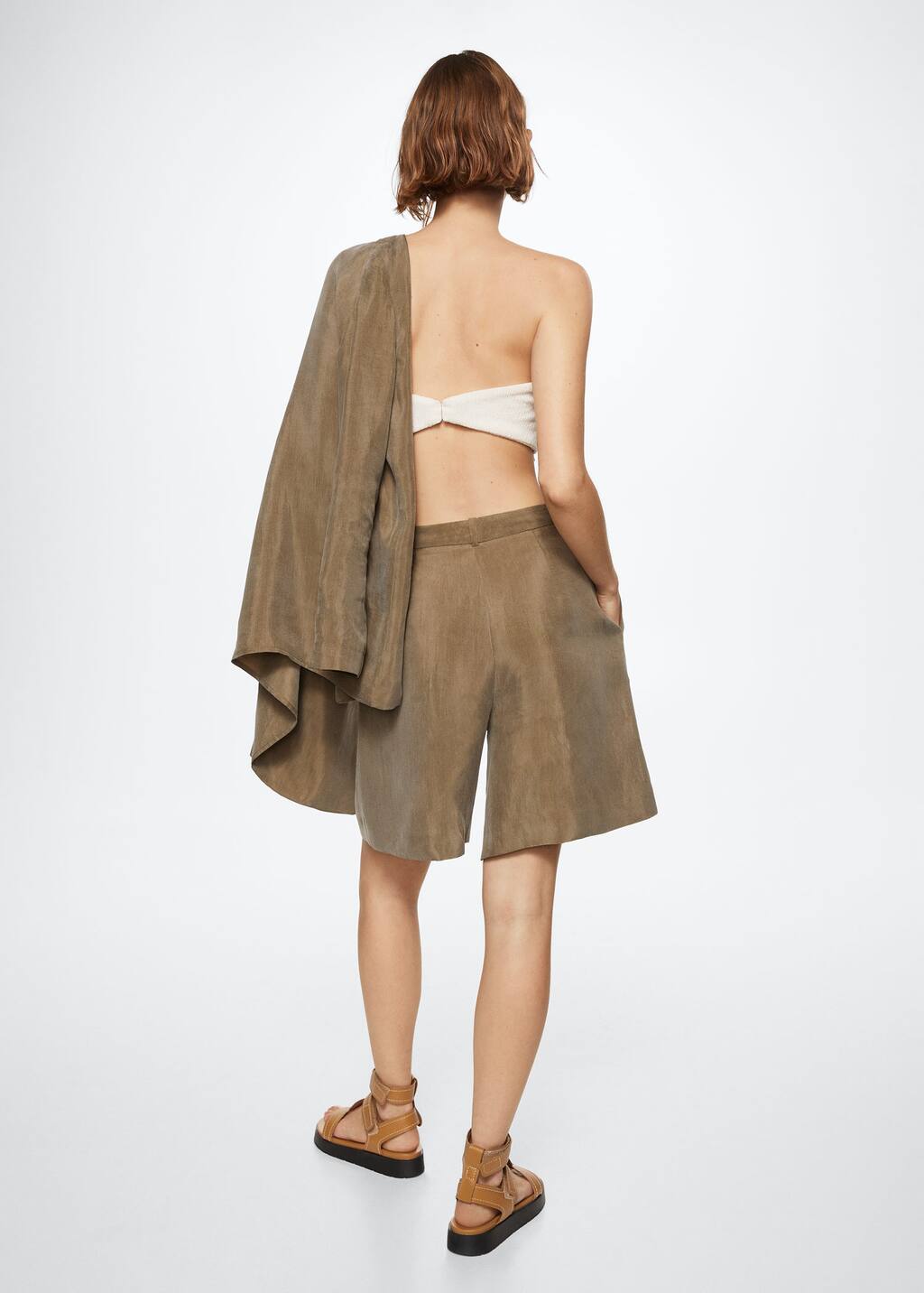 Mango Lyocell suit shorts. a woman in a tan top and brown shorts. 