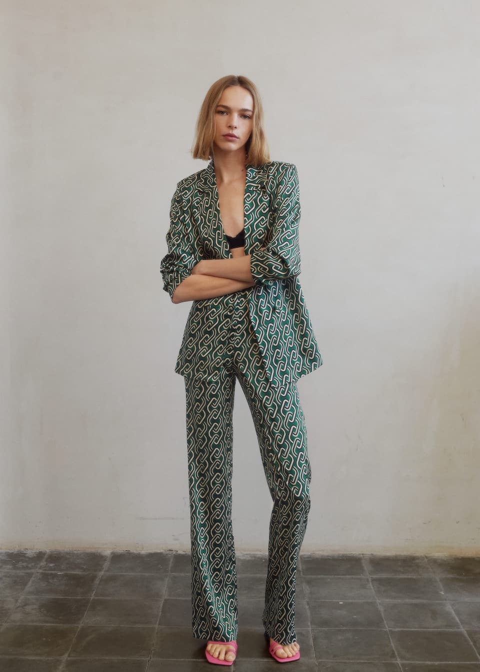 Green chain print shirt in a light fabric, with front double breasted closure. Shown with coordinating