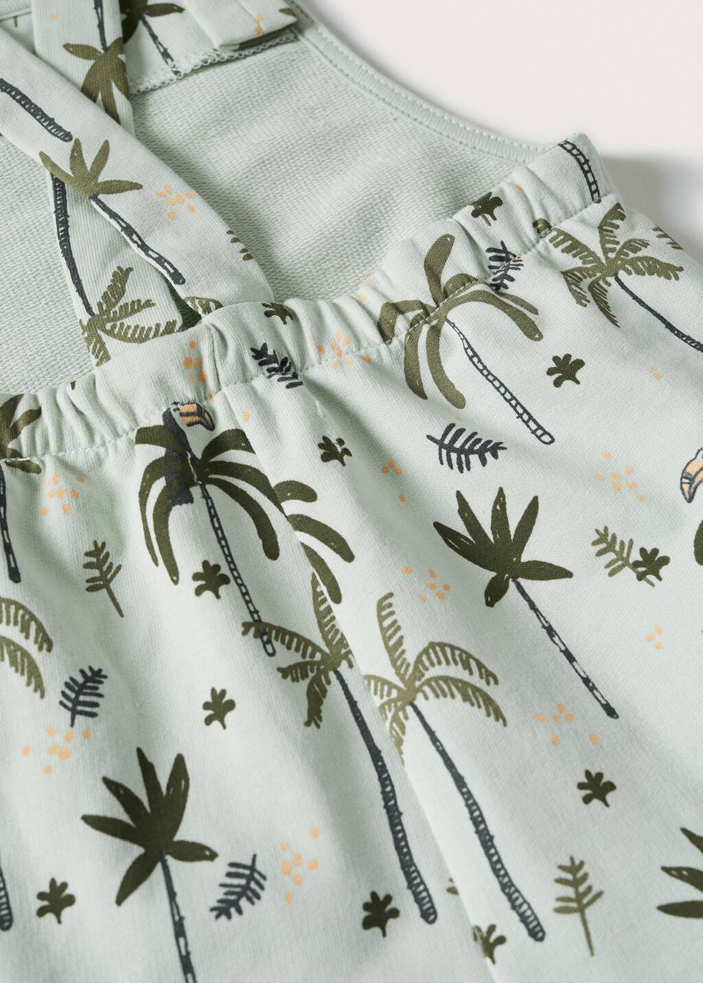 Mango Printed cotton dungarees. a close-up view of a palm tree pattern. 