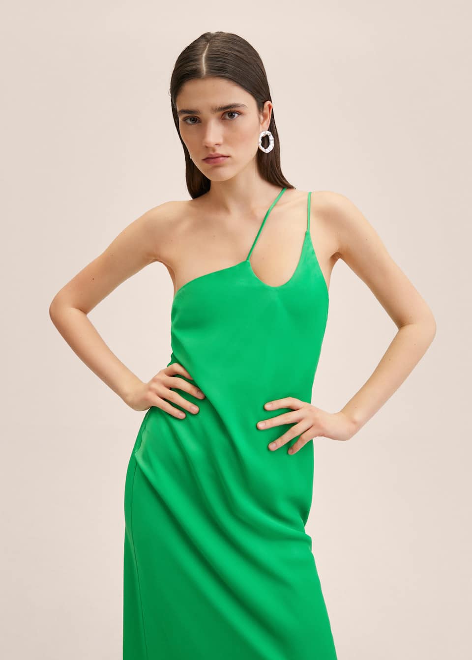 Ankle length green satin dress with asymmetric on shoulder double strap detail.