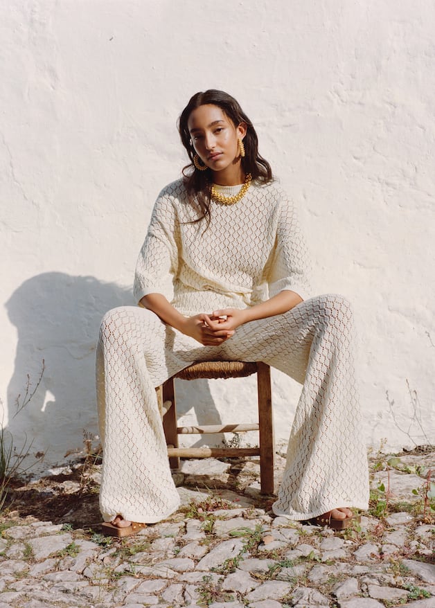 Mango Ecru openwork knit trousers with wide-leg flared design. Matching short sleeve knit top available.