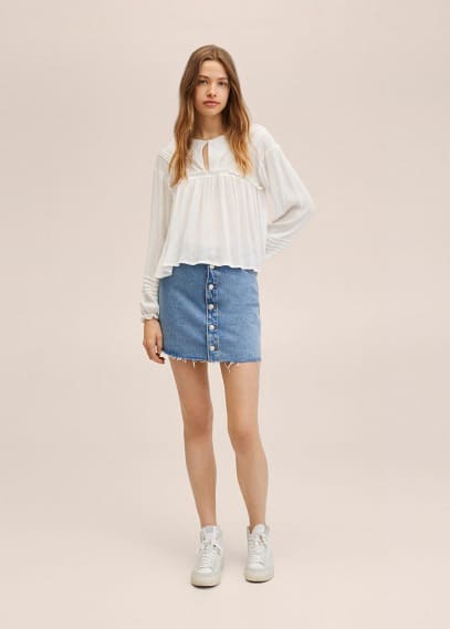 Blusa dettagli plissettati