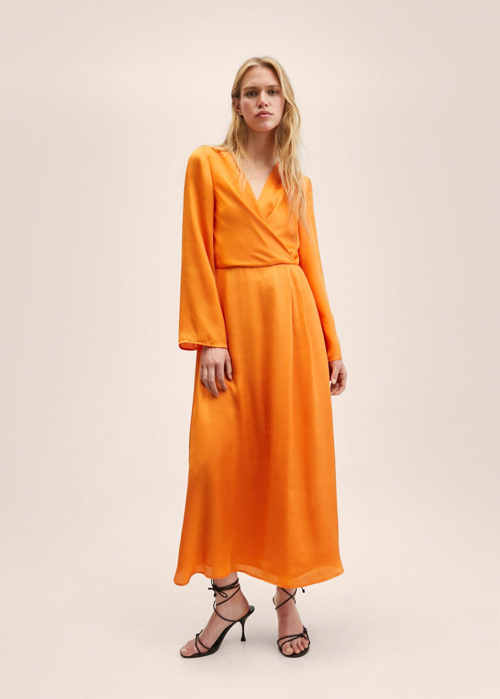 Marigold Satin dress in maxi length. Long flared sleeves, wrap neck, and Elastic waist.