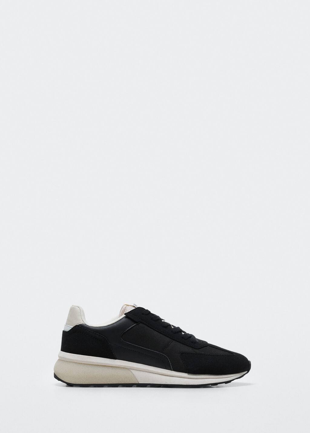 Mango Volume sole sneakers. a pair of black and white sneakers on a white background. 