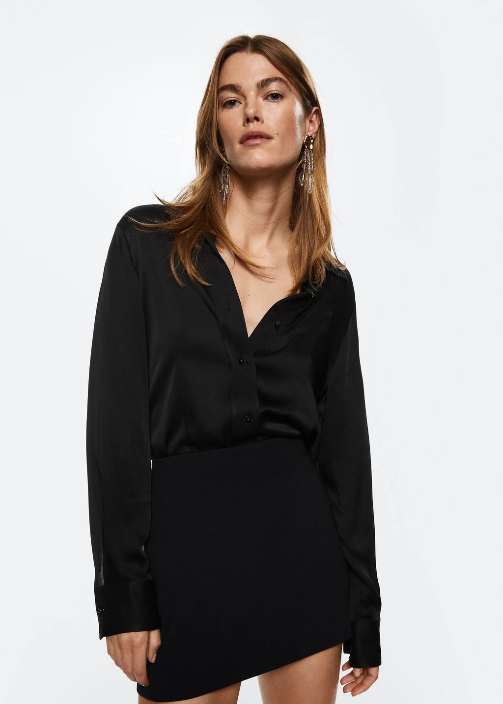 Mango Slit hem skirt. a woman in a black shirt and black skirt. 