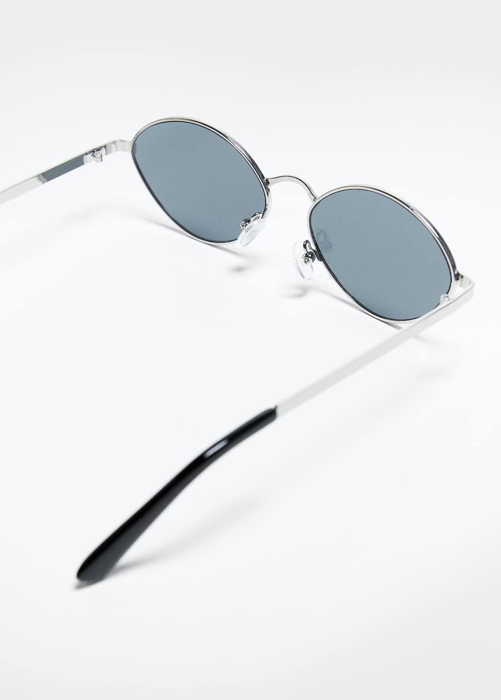 Mango Acetate frame sunglasses. a close up of a pair of sunglasses on a table 