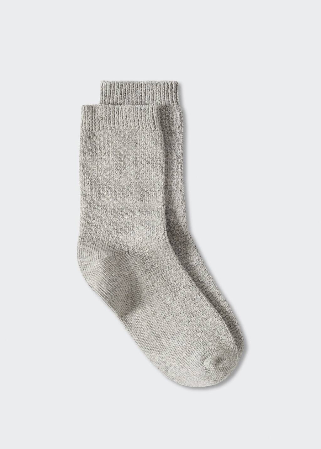 Mango Ribbed cotton socks. a pair of socks that are on the ground. 