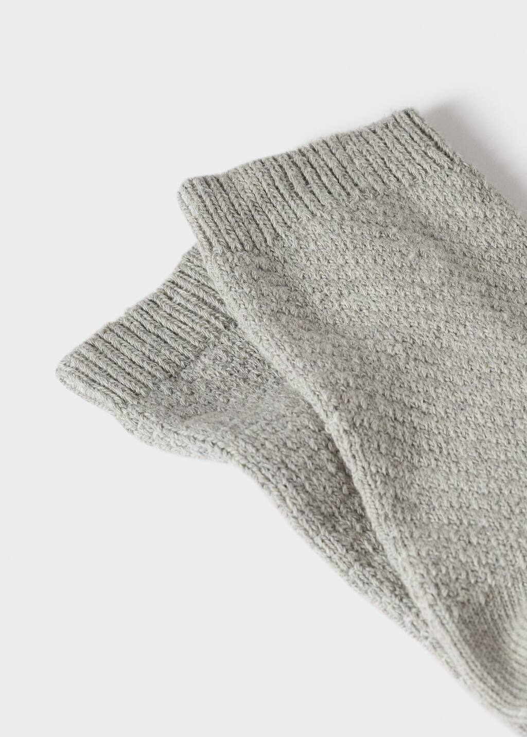 Mango Ribbed cotton socks. a close up of a pair of socks on a table 