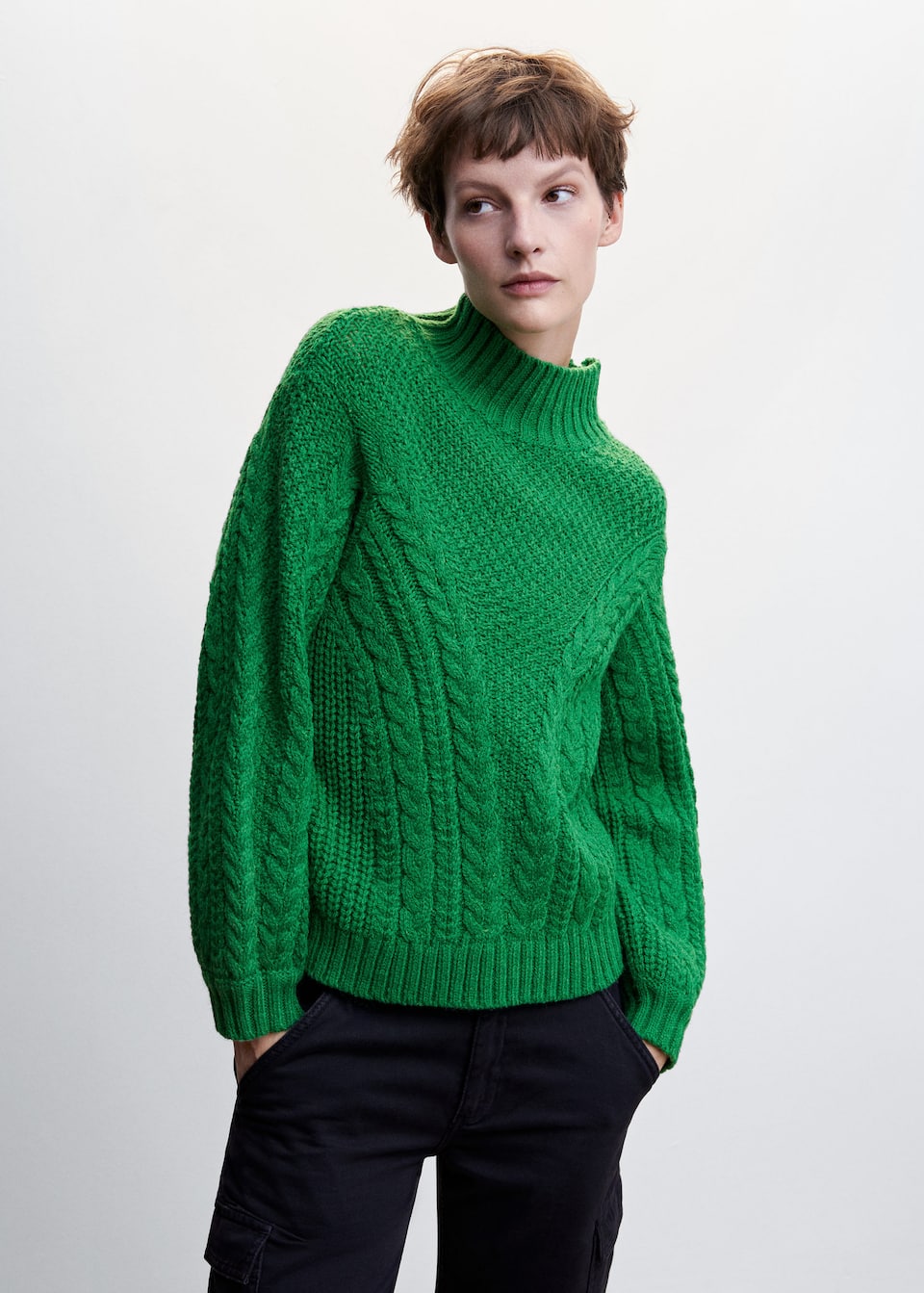 Mango green Thick knitted fabric. Knitted braided fabric. Straight design. High collar. Long sleeve. Cable knit finish.