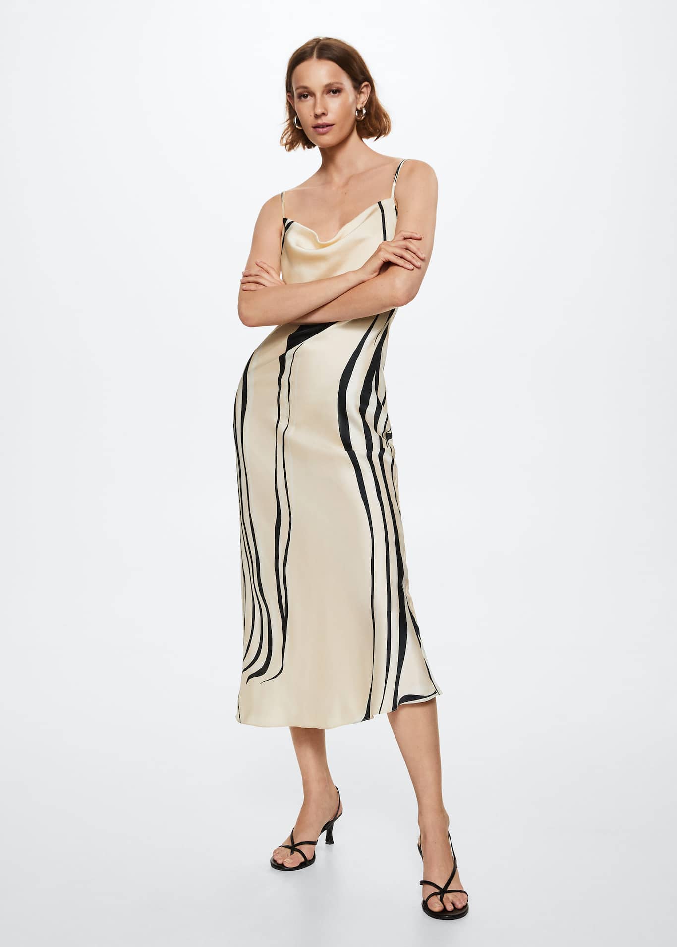 Mango cream and black wavy abstract printed midi slip dress with a draped neck and thin straps that crossover at the back.