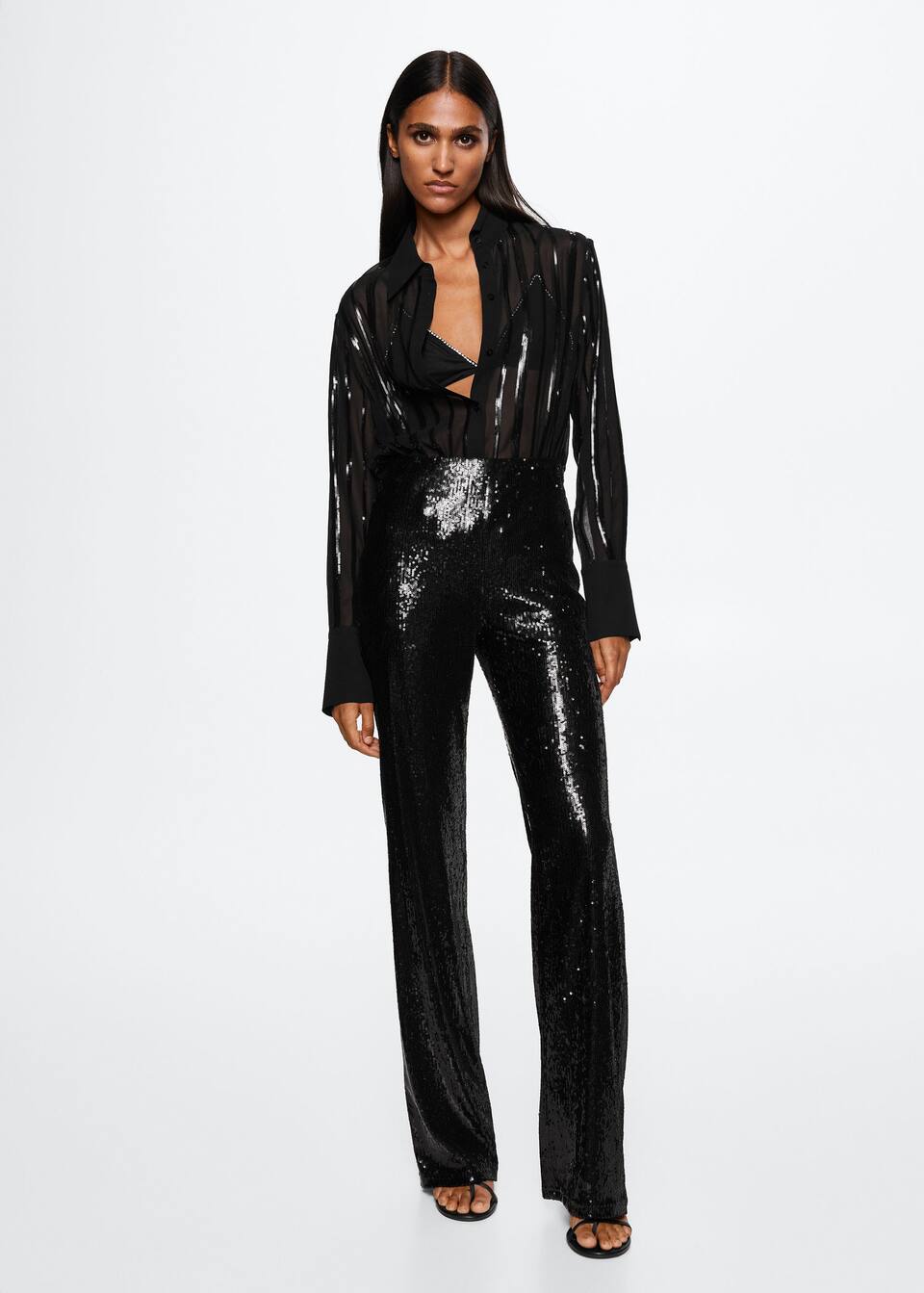 Mango black high waisted sequinned trousers. These party pants have. long and straight design with an Invisible side zip fastening and Inner lining.