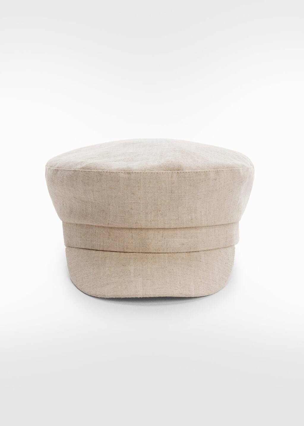 Mango Cap with visor. a white hat sitting on top of a white floor. 