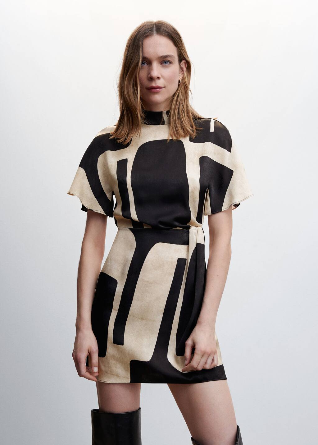 Mango Printed turtleneck dress. a woman wearing a black and white dress. 