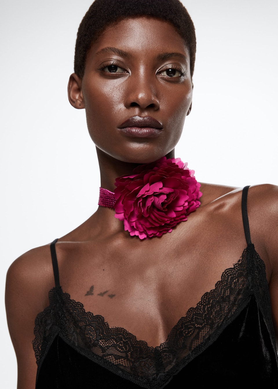 Mango Flower detail choker. Unclosed. Chain mail chain with attached corsage flower detail in hot pink. Party and events collection.