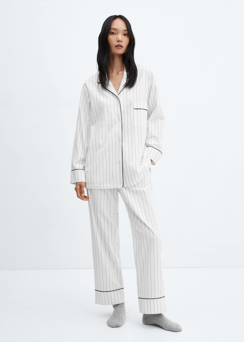 Mango white flannel cotton pajamas with black thin stripes and contrast piping. Button fastening, chest pocket, and drawstring waist.