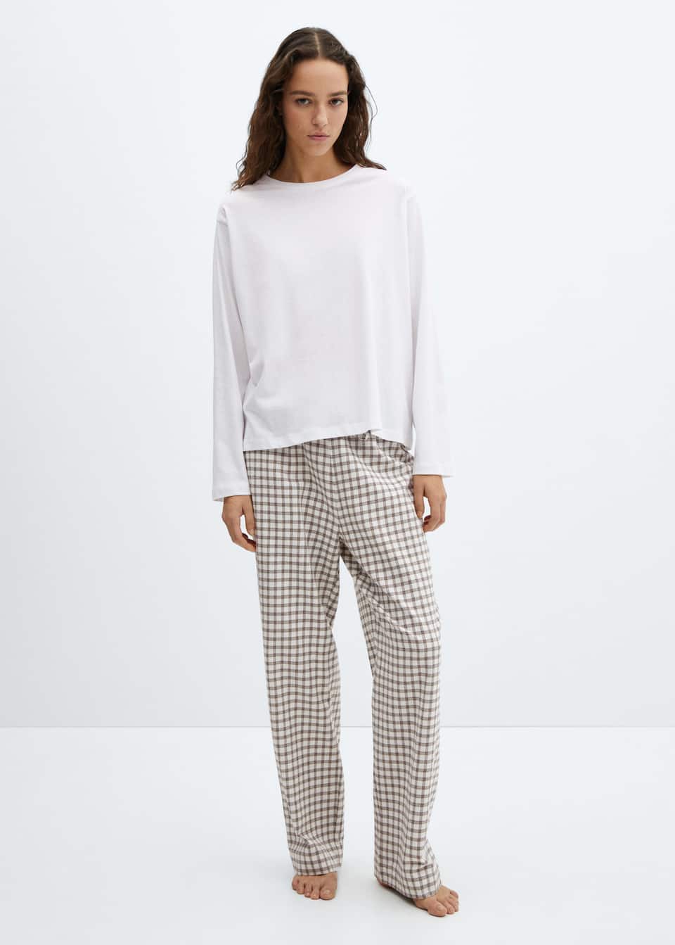 Mango checked pyjamas with beige and brown checked cotton drawstring bottoms and white cotton crew neck long sleeve top.