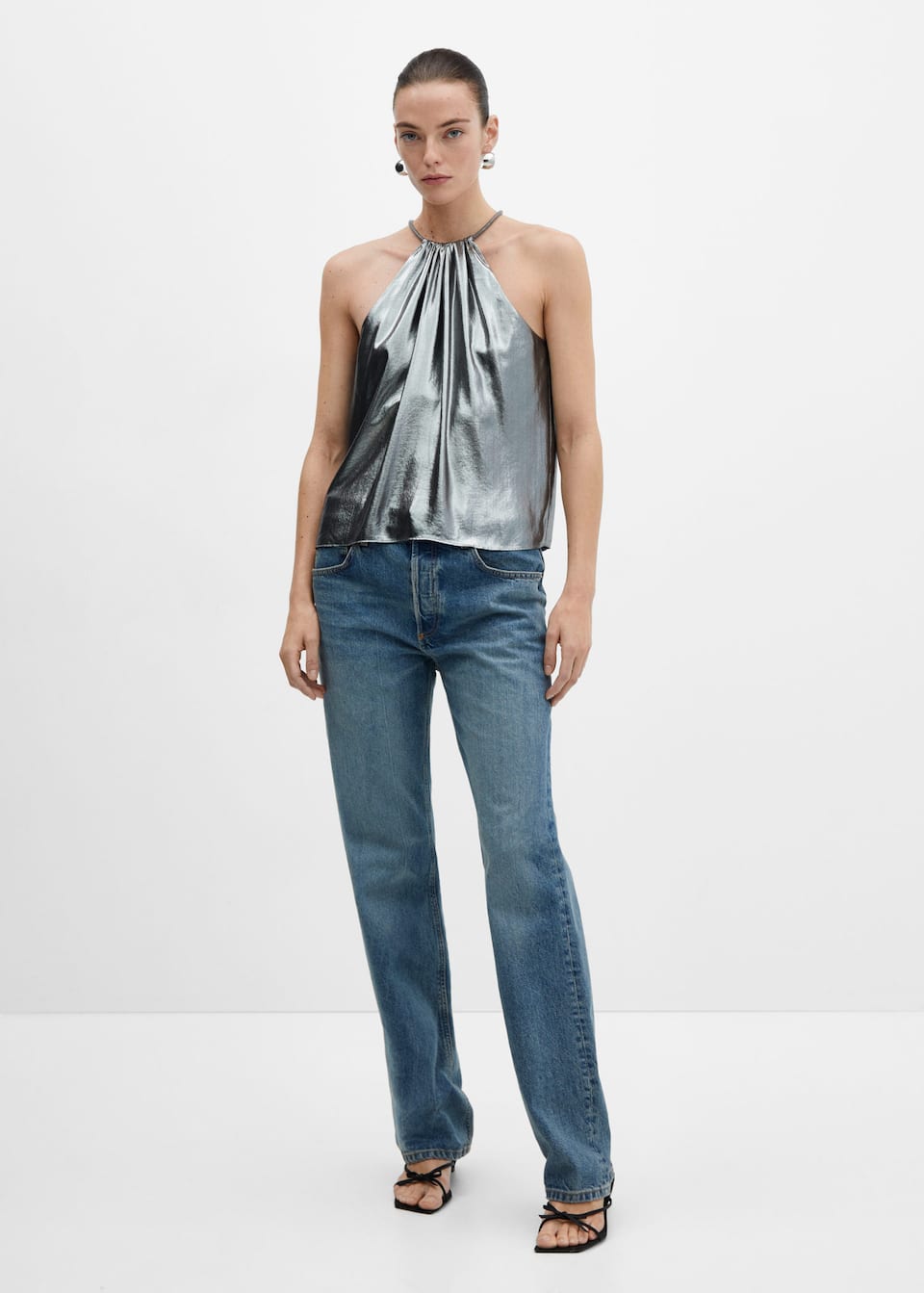 Mango silver metallic lame halter neck top with rigid chain collar detail. Zip and carabiner fastening.