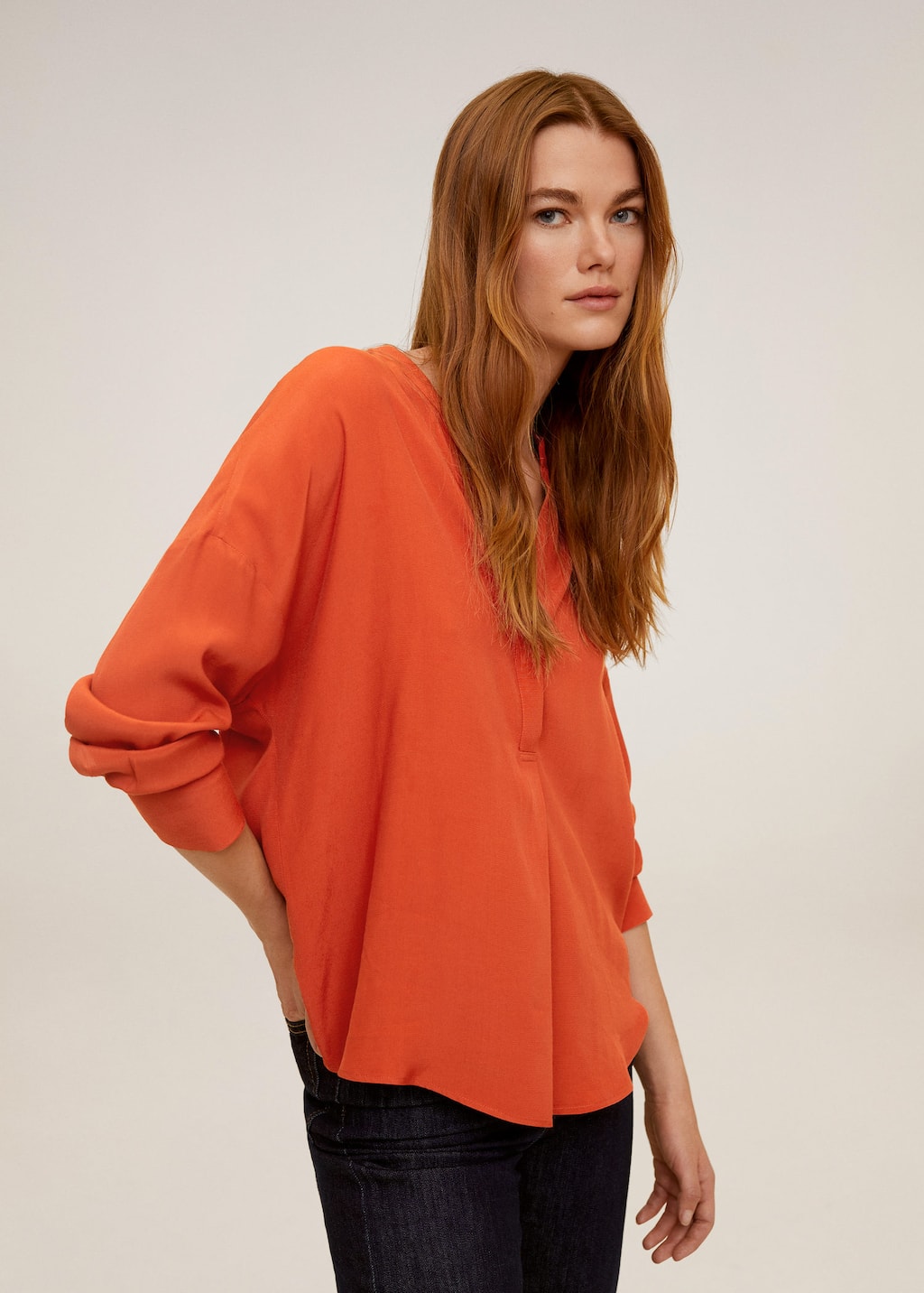orange flowy top