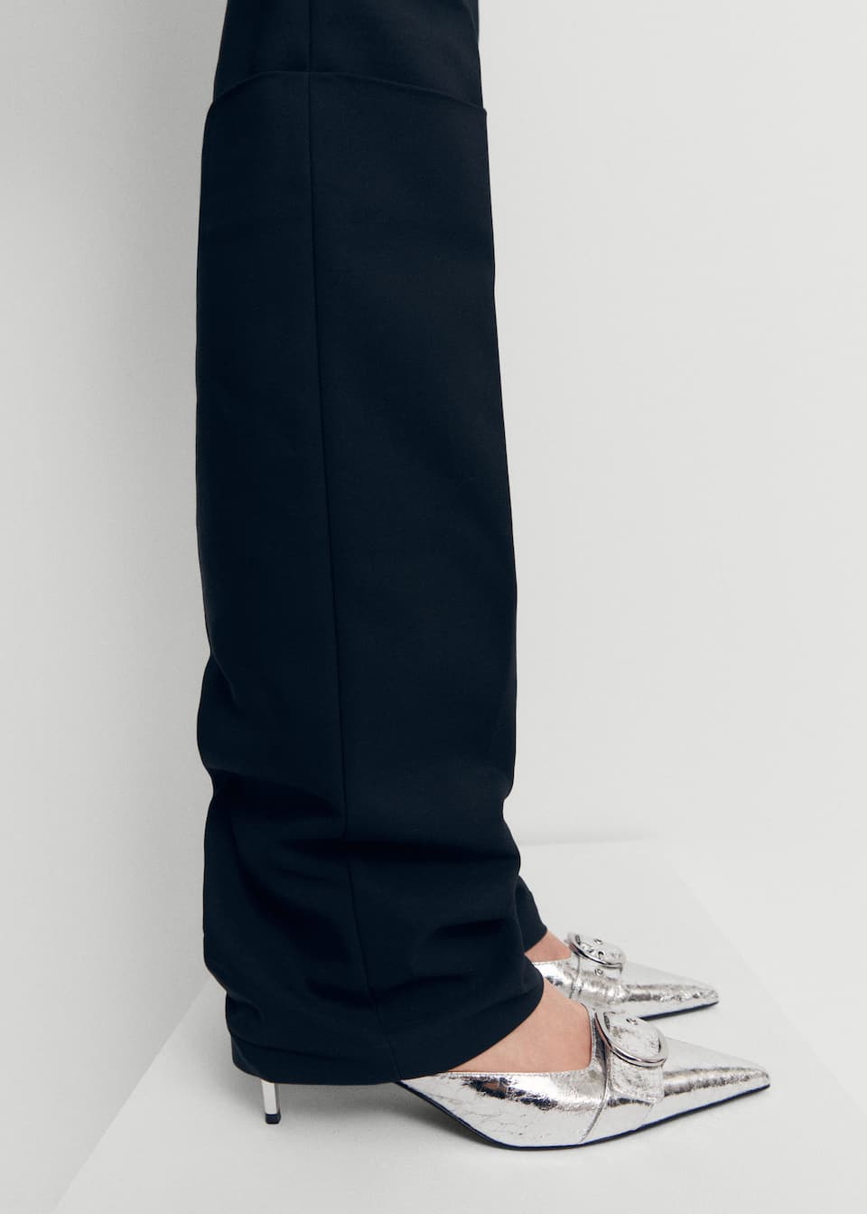 spring 2024 shoe trends - Mango silver Metallic pointed toe thin heeled shoe with buckle detail at front.