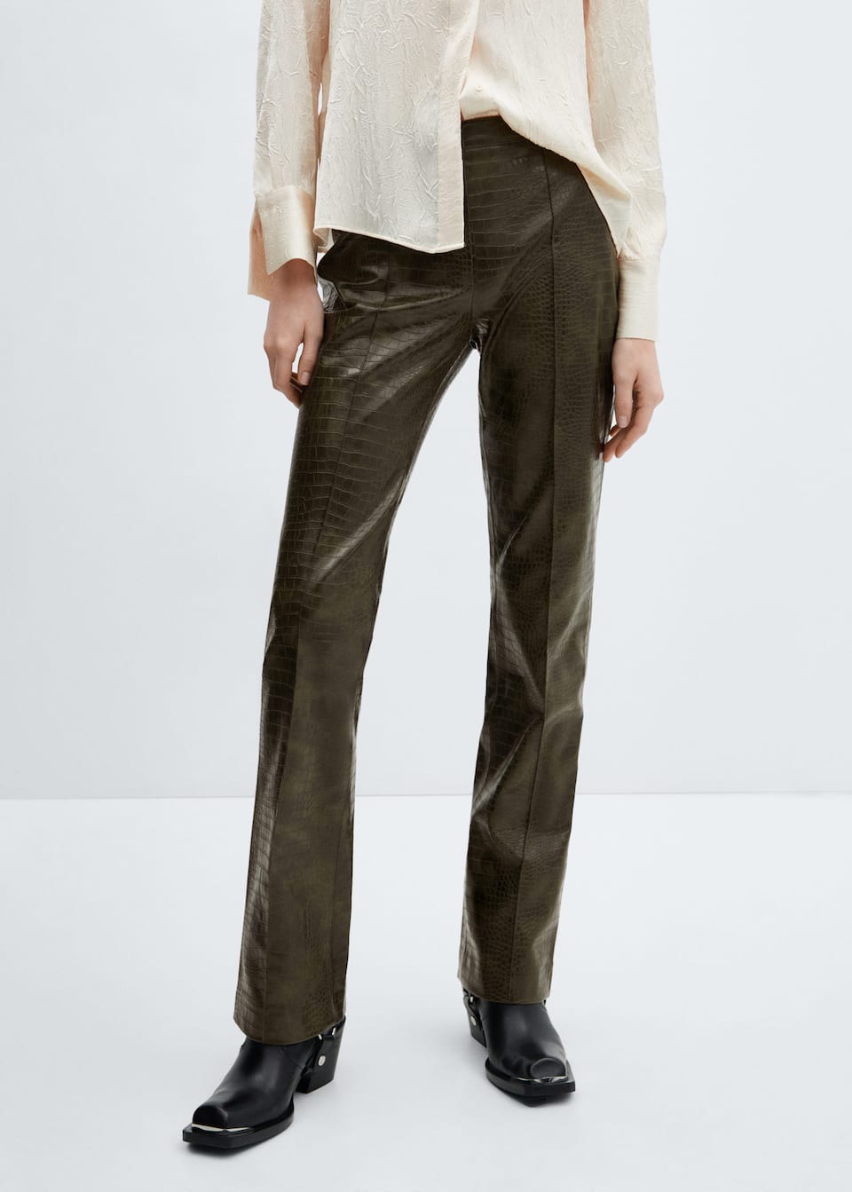 Tap into the fashion colour trends 2024 with these Mango green croc-effect flared trousers with piping.