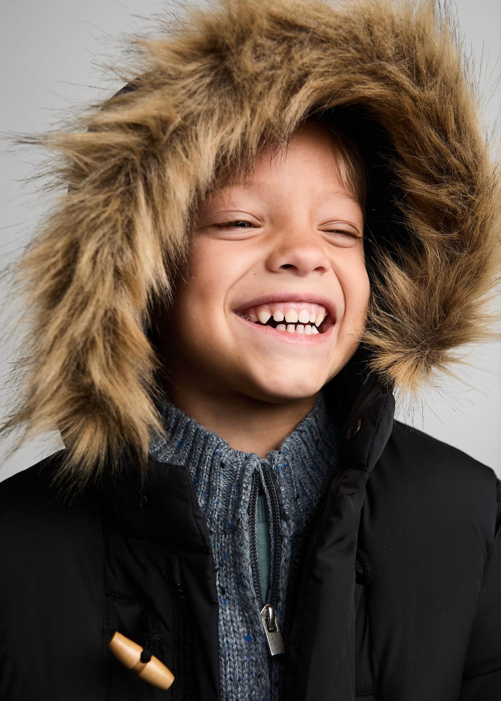 Quilted coat with fur-effect hood