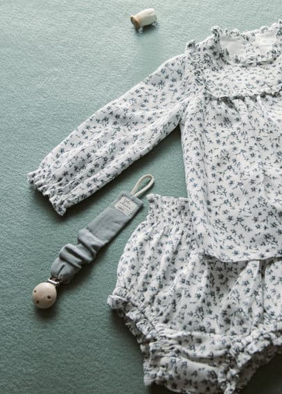 Attache-tétine broche