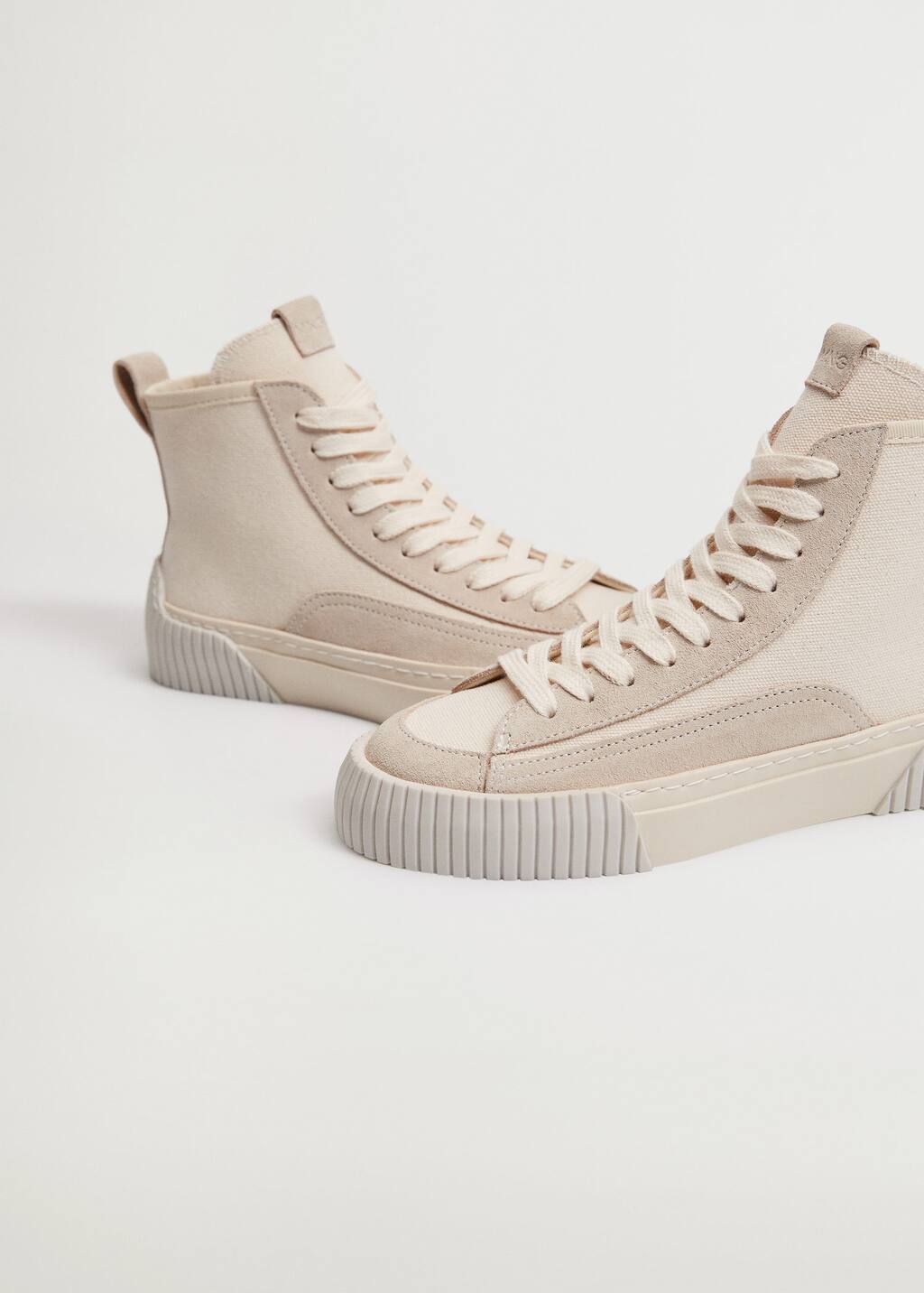 Mango Mineral dye leather sneakers. a close up of a pair of shoes on a white background Mango Mineral dye leather sneakers. a close up of a pair of shoes on a white background