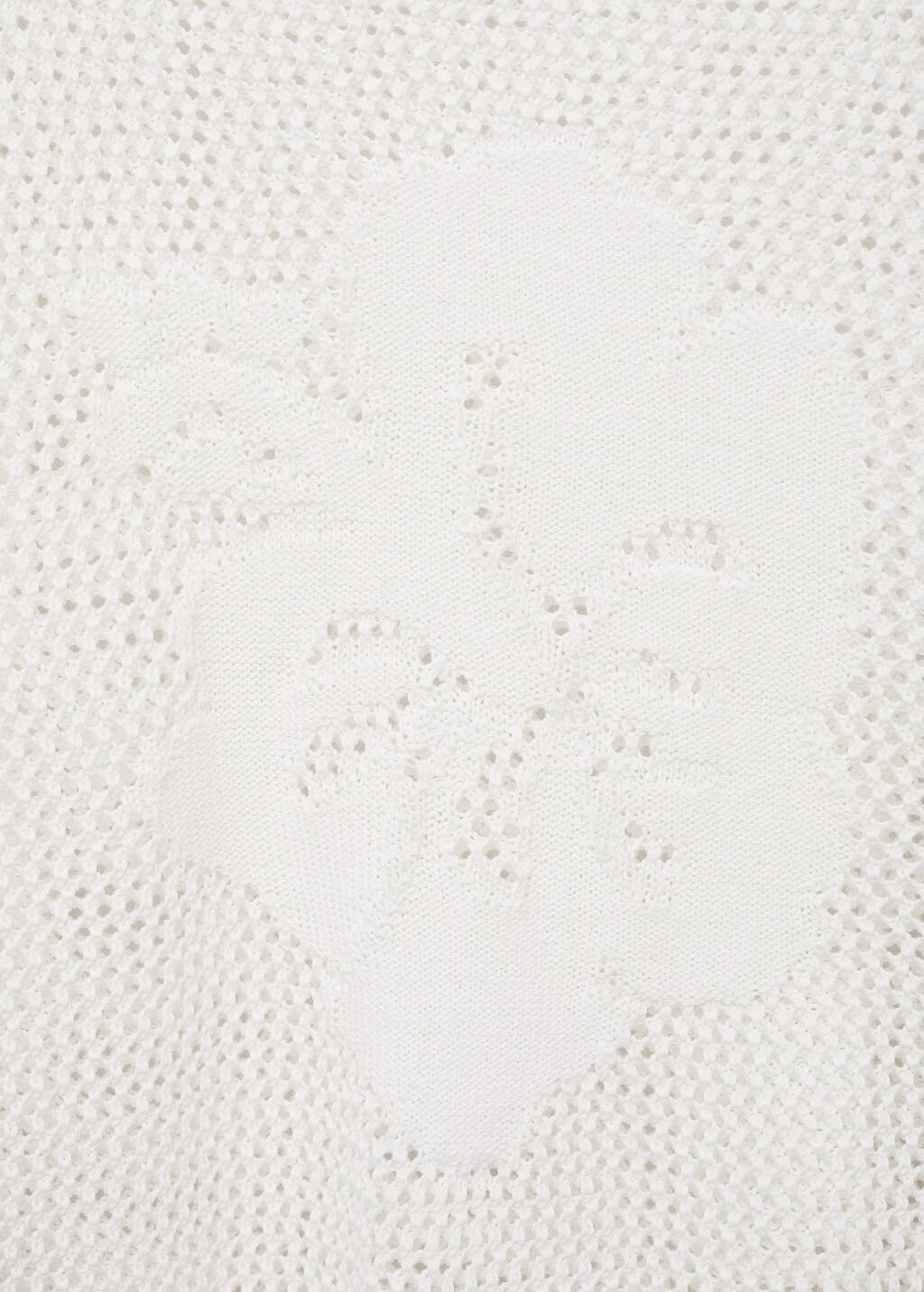 Knitted sweater with flower detail and lace pattern