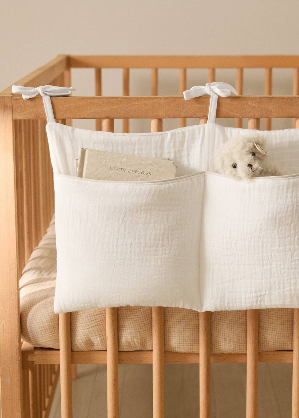 Cot organizer with piping
